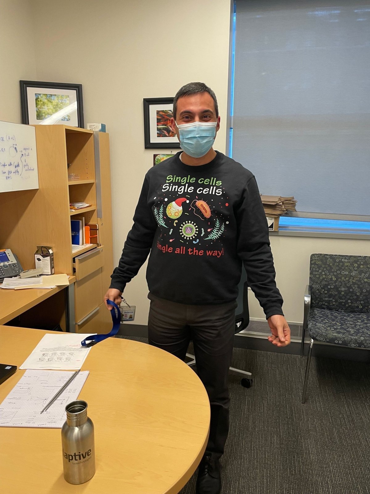 Ramin in a “Single cells, single all the way” holiday sweater